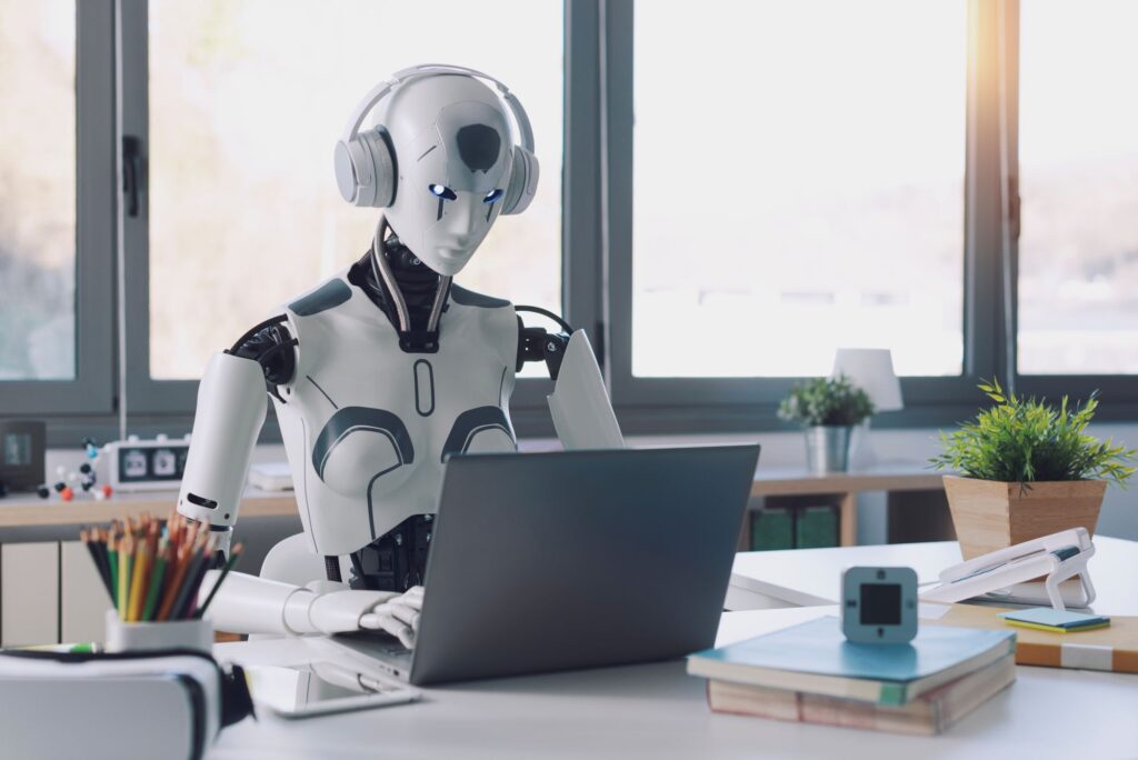 Robot using a computer to illustrate the myth of AI detecting AI-written content